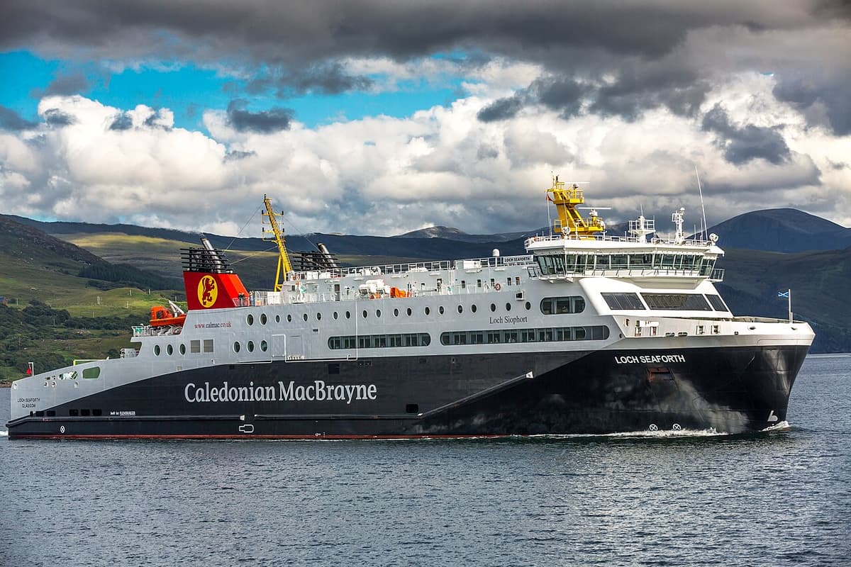 A black-and-white CalMac ferry at sea off the west coast