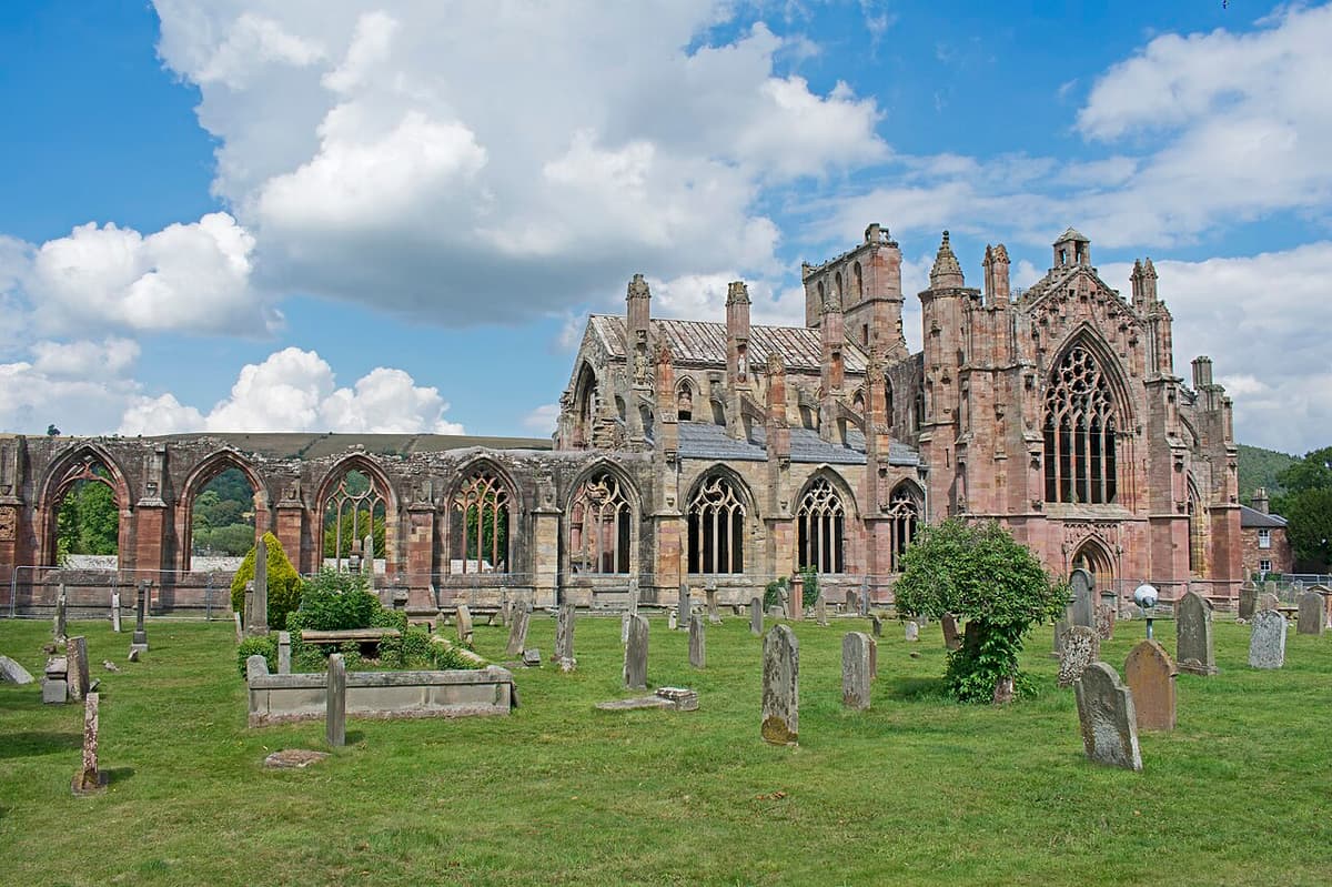 The red sandstone ruins of Melrose Abbey in the Scottish Borders