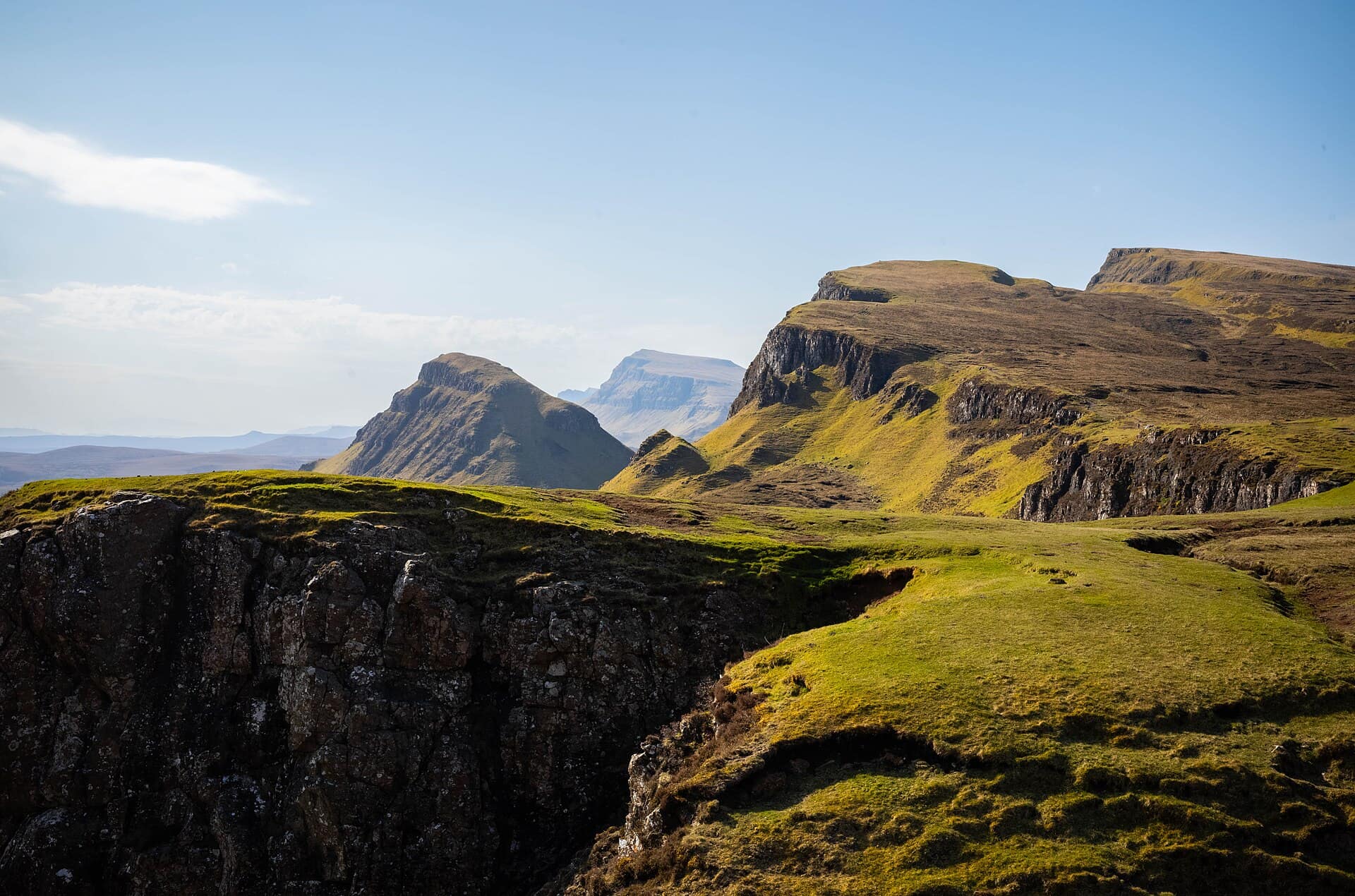 The ridges and pinnacles of the Quiraing on the Isle of Skye under a broken sky