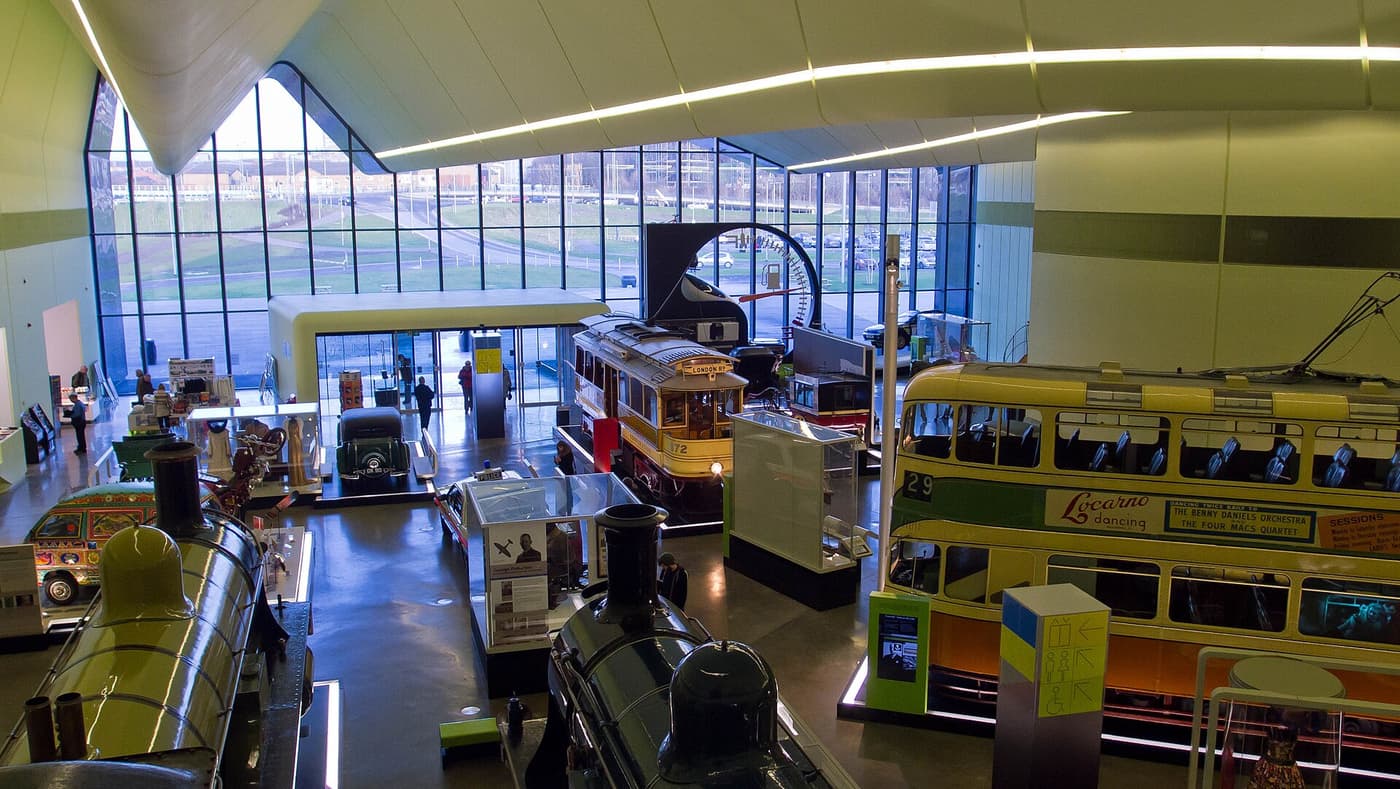 Historic trams, buses and locomotives on display inside the Riverside Museum
