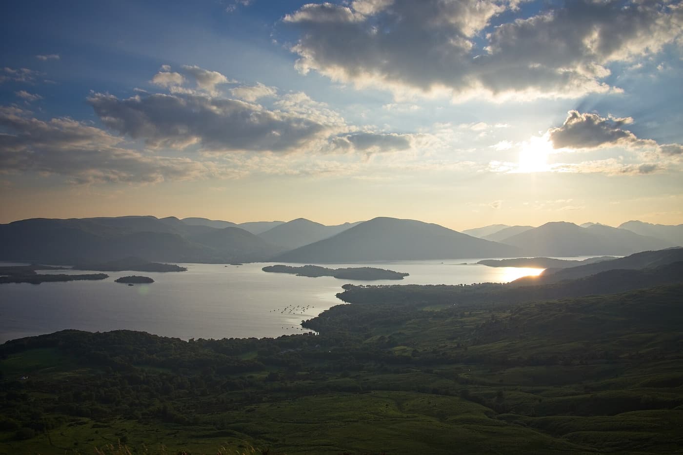 Loch Lomond and its islands seen from the top of Conic Hill at sunset