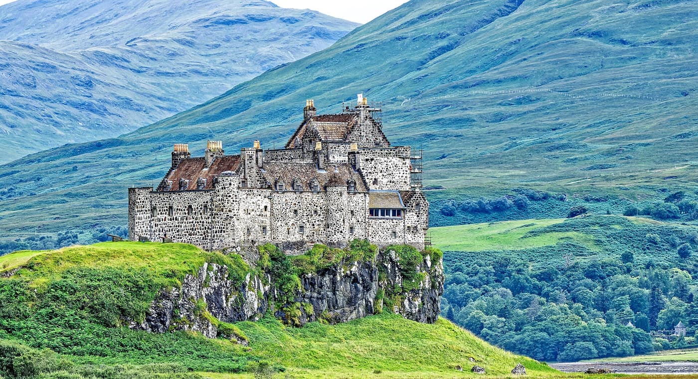 Duart Castle on its headland with the mountains of Mull behind