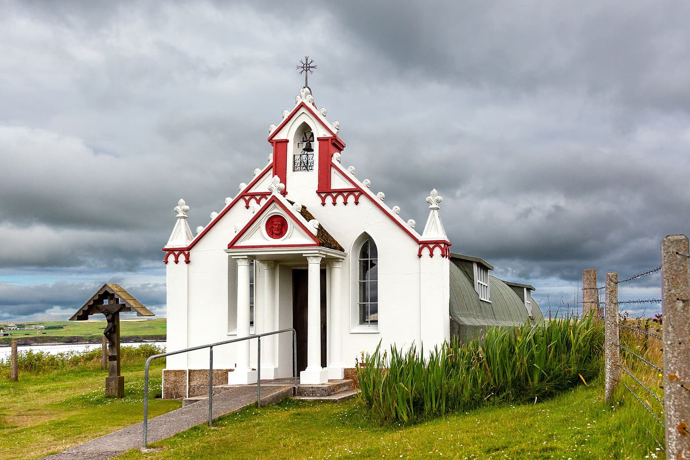 The small white-and-red façade of the Italian Chapel on Lamb Holm