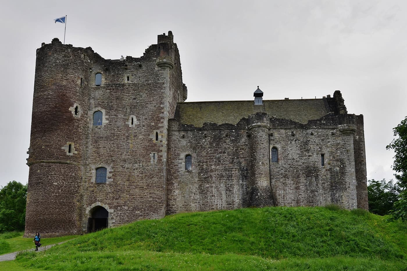 The grey stone walls and gatehouse of Doune Castle