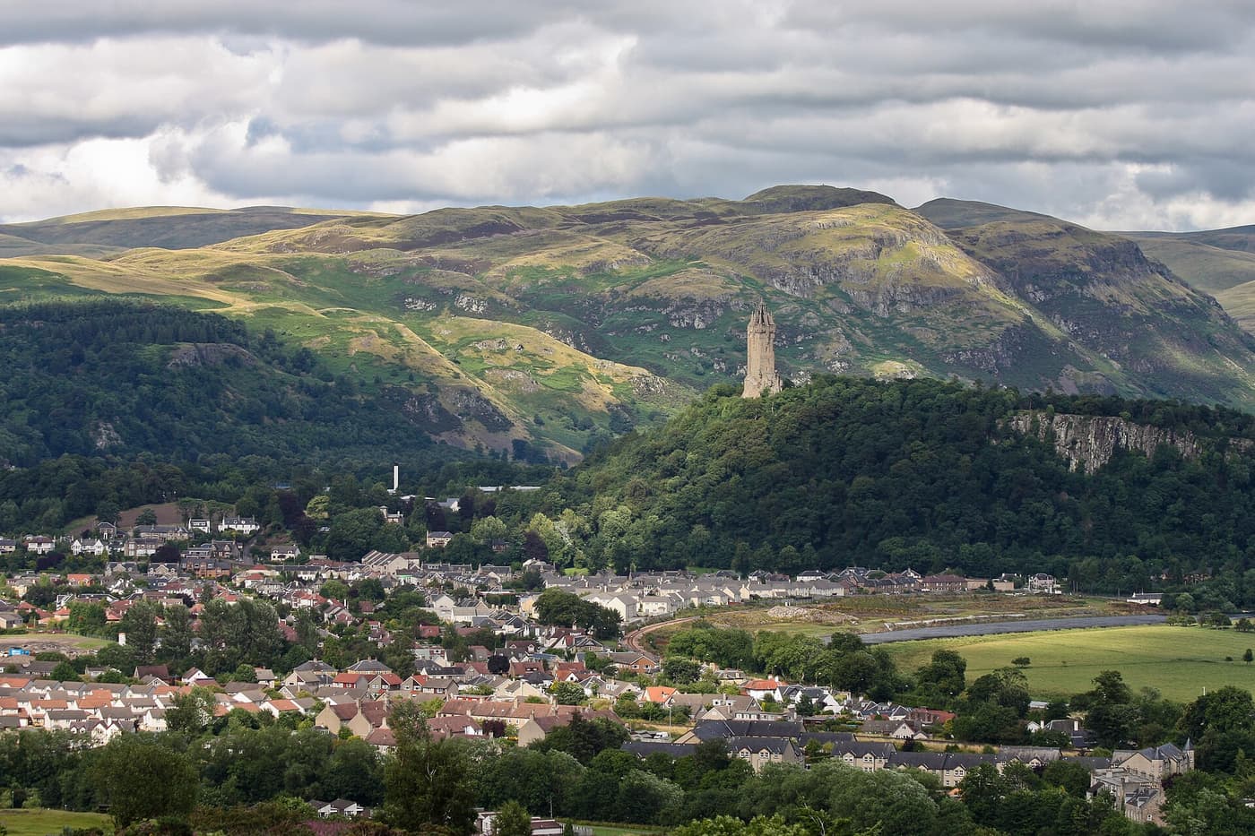 The National Wallace Monument on wooded Abbey Craig, with the Ochil Hills behind